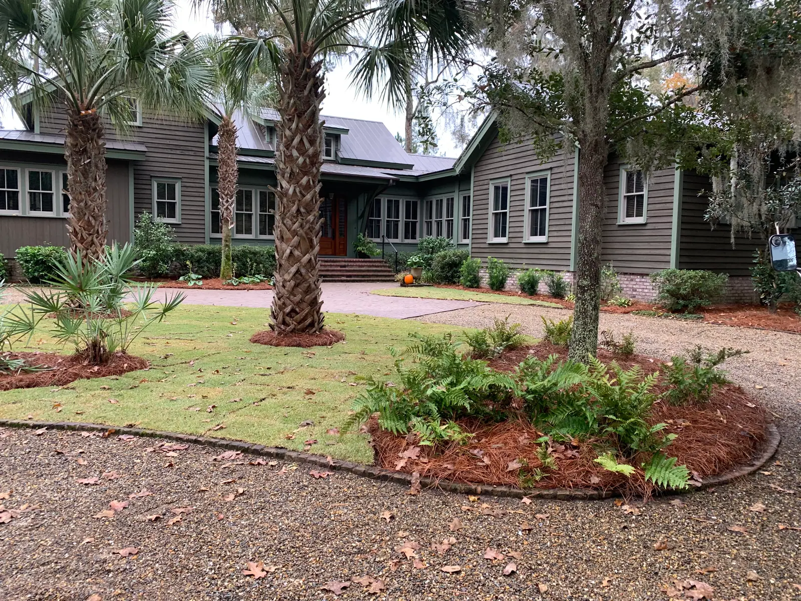 Pinestraw installed around trees and shrubs